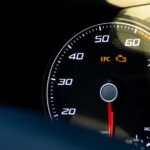 Check engine warning light on a car dashboard