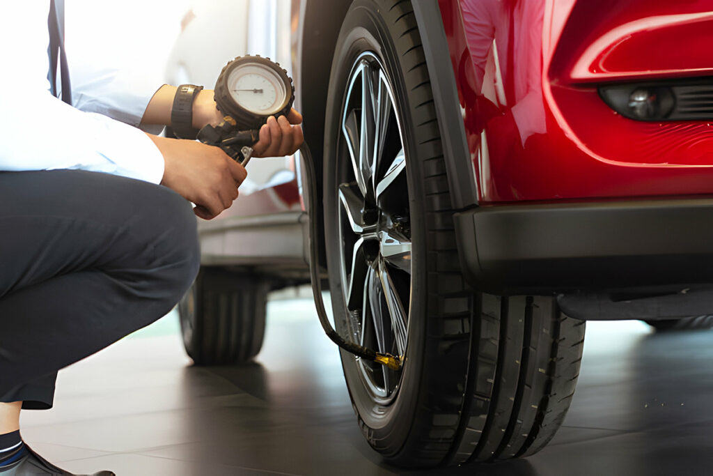 Asian man car inspection Measure quantity Inflated Rubber tires car